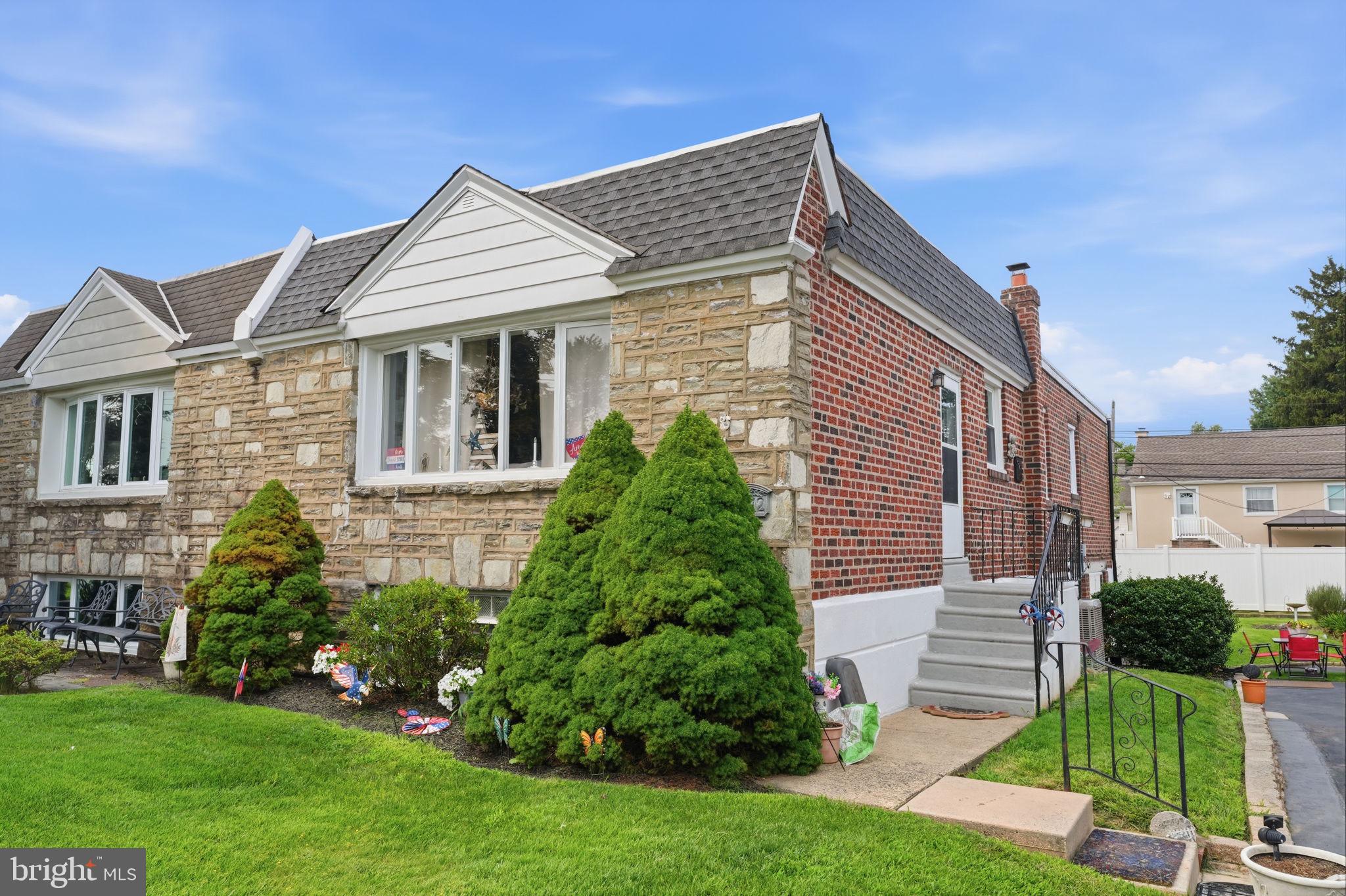 2012 Tomlinson Road Philadelphia, PA 19116 - Photo 1 of 33 Charming brick home with lush greenery.