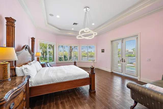 a spacious bathroom with a granite countertop sink mirror and a bathtub