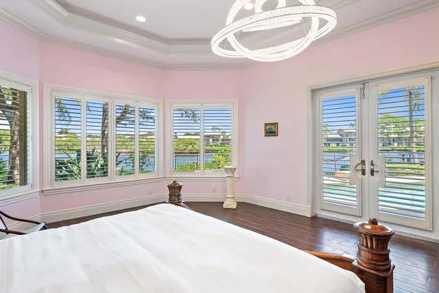 a spacious bathroom with a granite countertop sink mirror and a shower