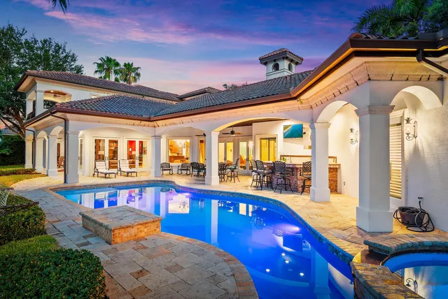 a view of a swimming pool with an outdoor seating