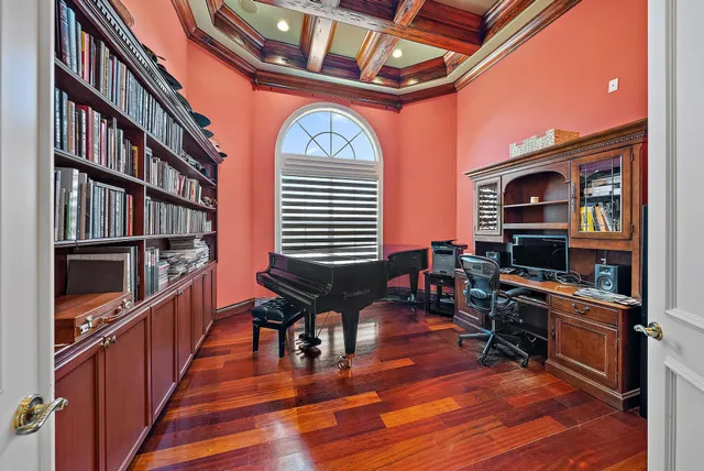 a room with furniture a rug and a flat screen tv