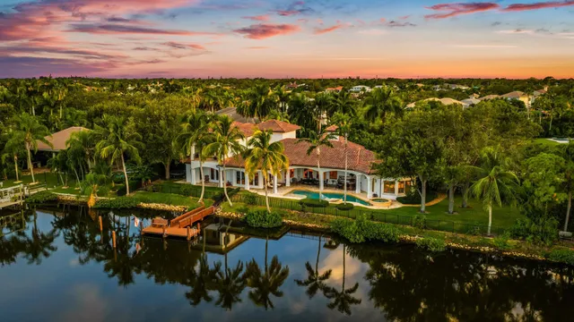 a view of residential houses with outdoor space and lake view
