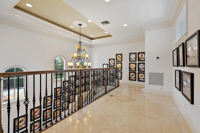 a view of a balcony with wooden floor and lake view