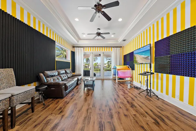 a view of a swimming pool with lawn chairs and a big yard