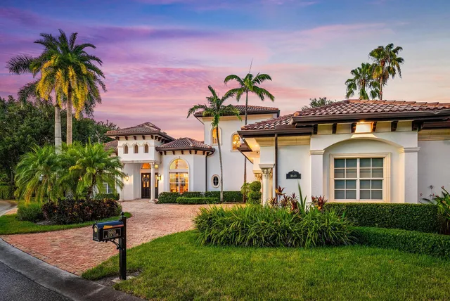an aerial view of a houses with yard