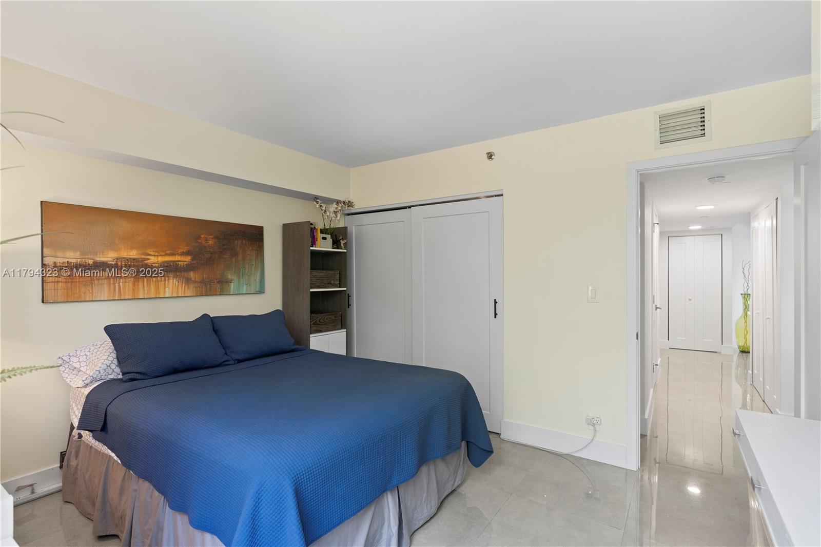 3600 Mystic Pointe Drive, Unit 306 Aventura, FL 33180 - Photo 11 of 52 a bedroom with a bed and cabinet