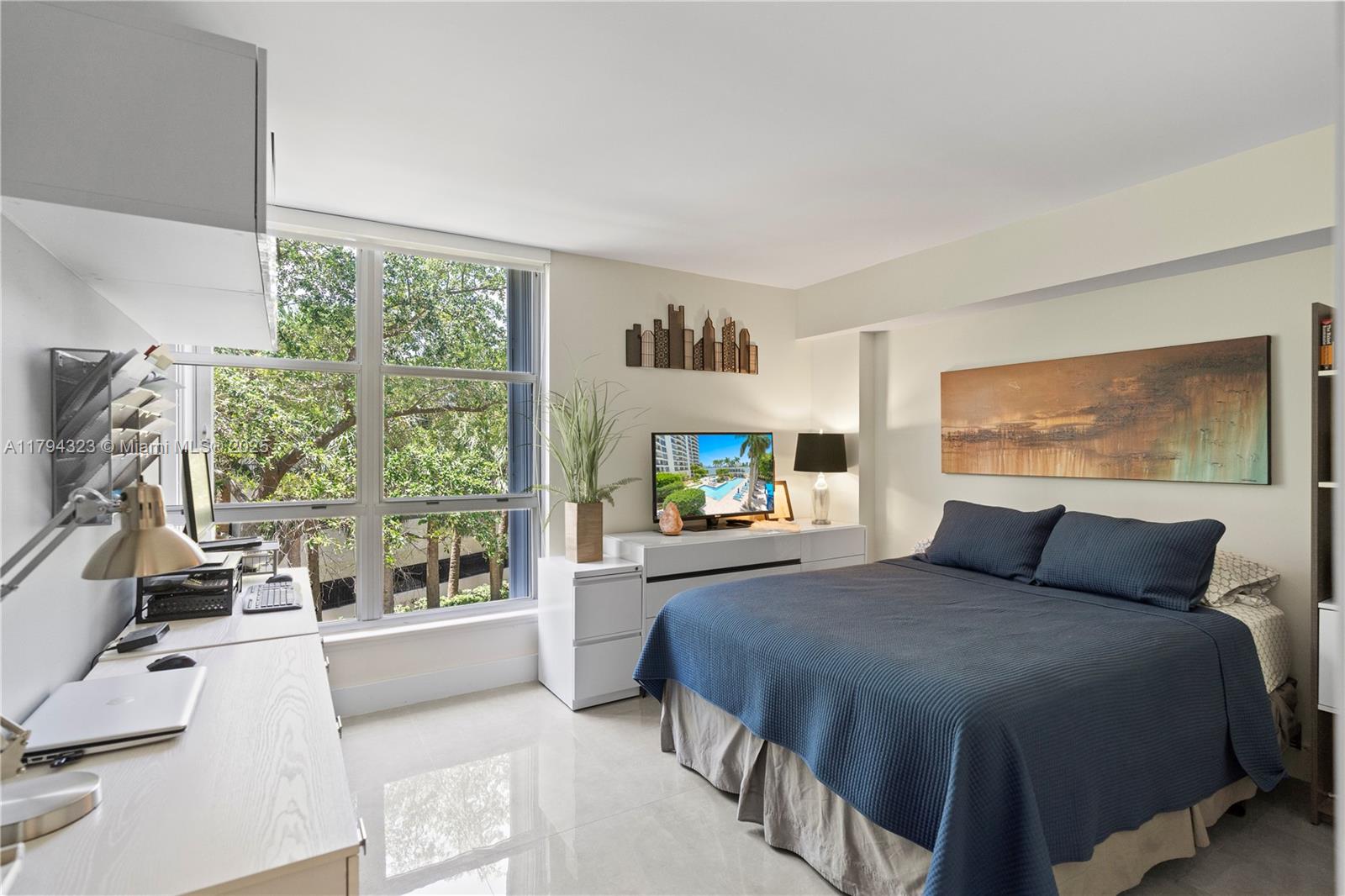 3600 Mystic Pointe Drive, Unit 306 Aventura, FL 33180 - Photo 12 of 52 a bedroom with a large bed and a tv