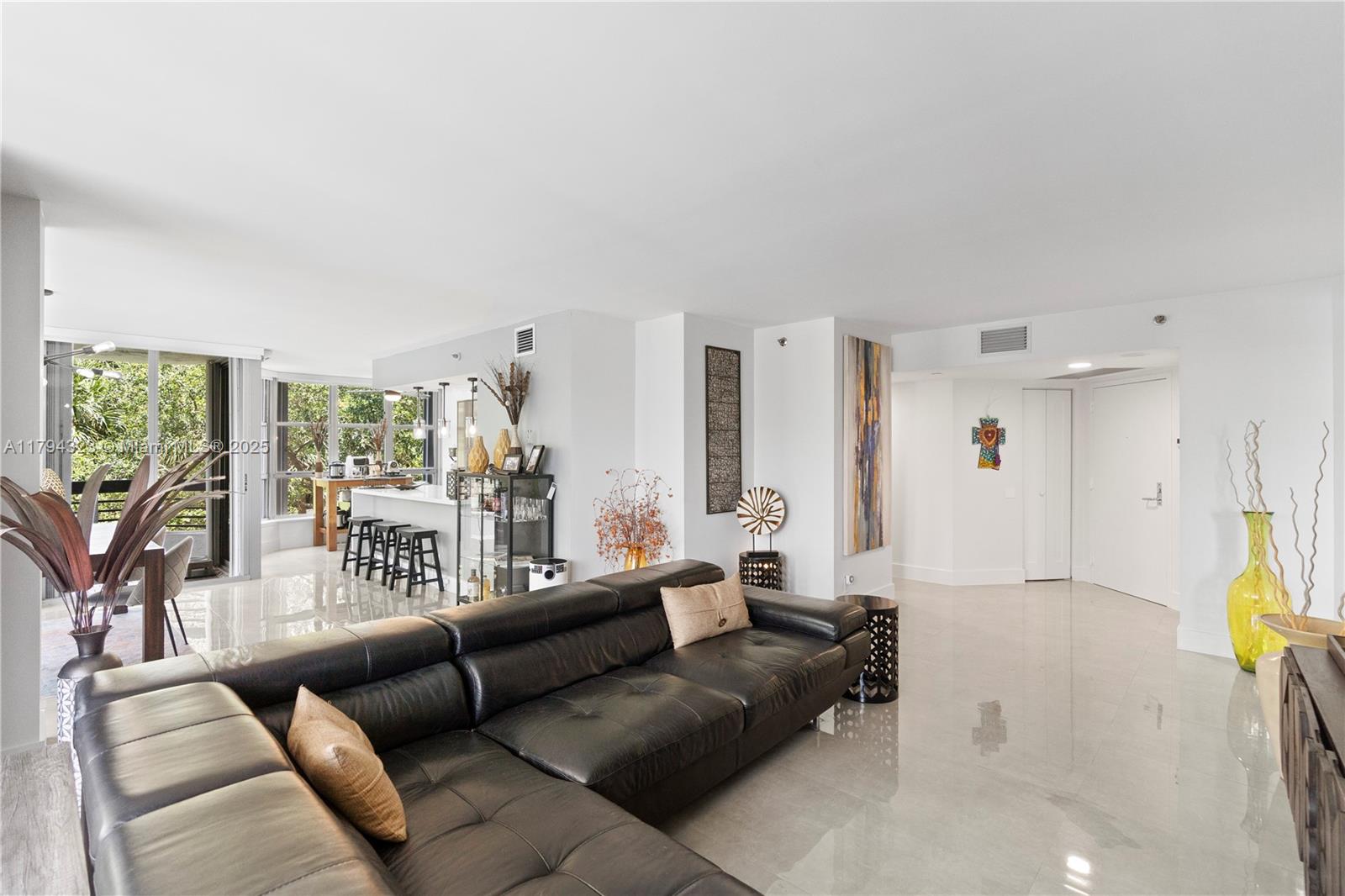 3600 Mystic Pointe Drive, Unit 306 Aventura, FL 33180 - Photo 15 of 52 a living room with furniture and a large window