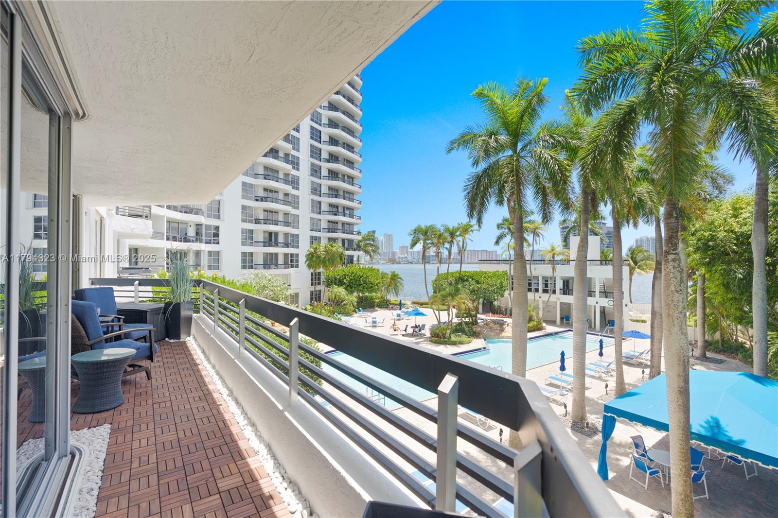 3600 Mystic Pointe Drive, Unit 306 Aventura, FL 33180 - Photo 22 of 52 a city view from a balcony with outdoor seating