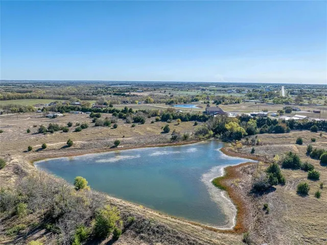 an aerial view of a beach with a yard