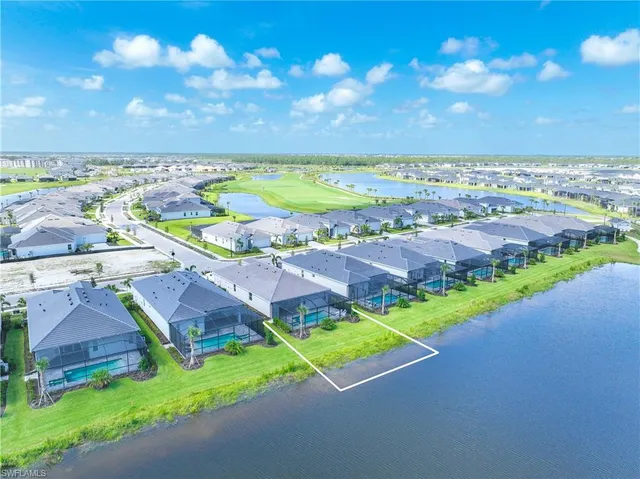 a view of a swimming pool with a yard