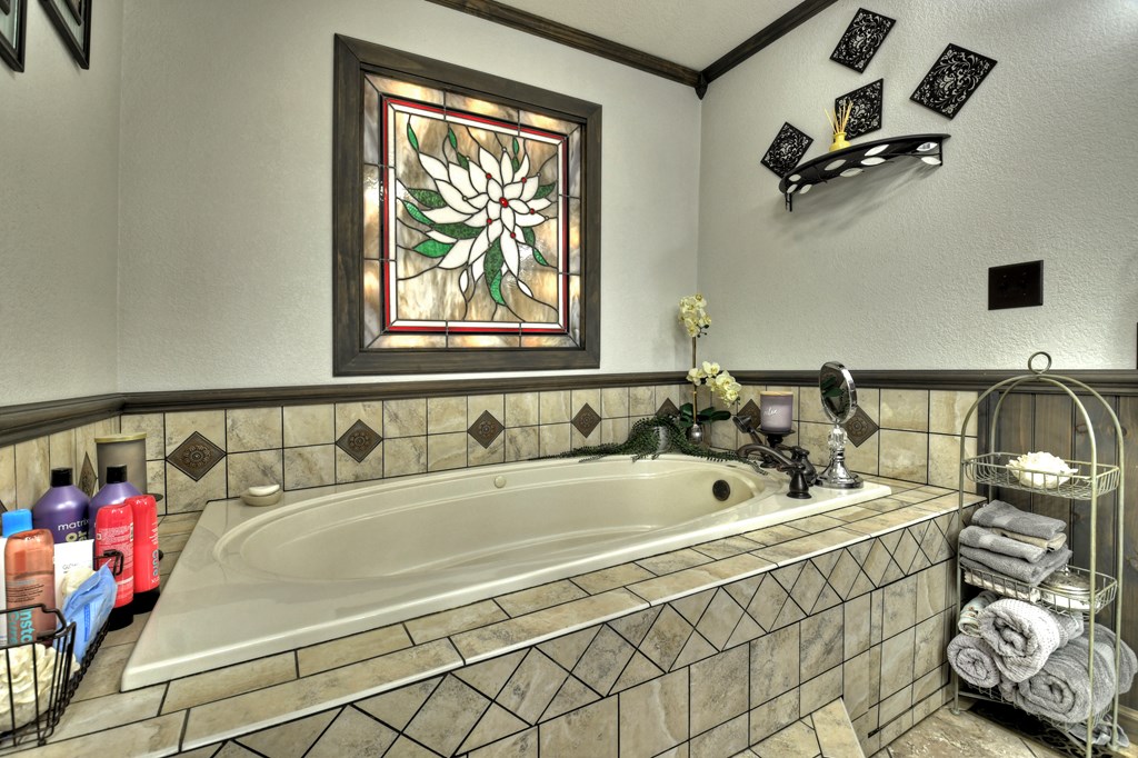 270 Stone Lane Blue Ridge, GA 30513 - Photo 47 of 70 a spacious bathroom with a tub and a window