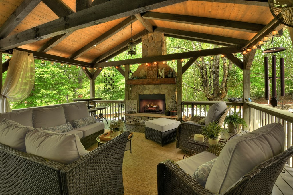 270 Stone Lane Blue Ridge, GA 30513 - Photo 5 of 70 a outdoor living space with patio furniture and a fireplace