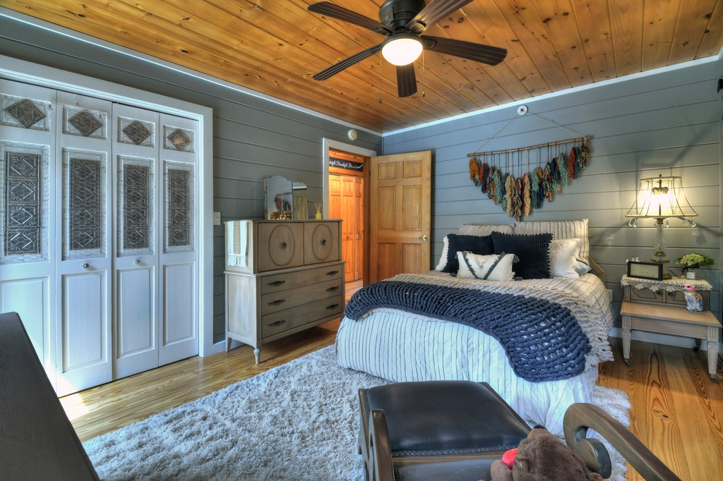 270 Stone Lane Blue Ridge, GA 30513 - Photo 52 of 70 a bedroom with a bed and wooden floor
