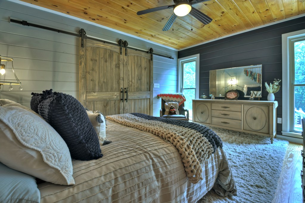 270 Stone Lane Blue Ridge, GA 30513 - Photo 53 of 70 a spacious bedroom with a bed and a cabinets