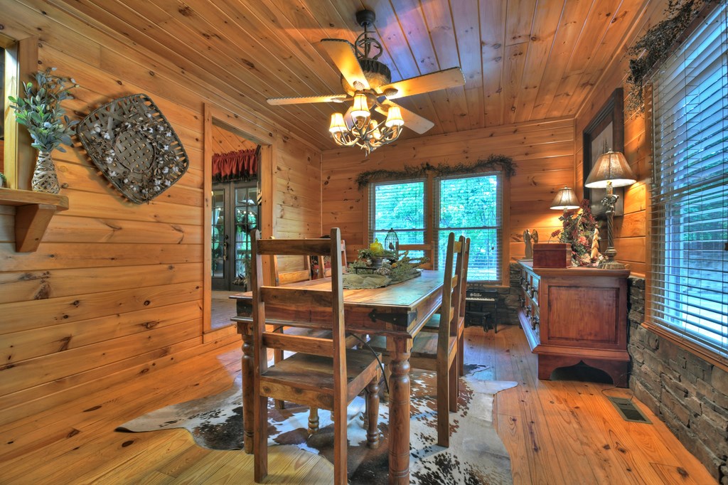 270 Stone Lane Blue Ridge, GA 30513 - Photo 57 of 70 a view of a dining room with furniture and chandelier