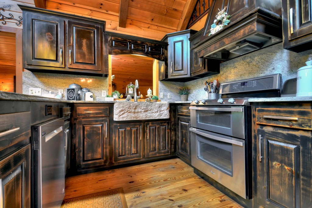 270 Stone Lane Blue Ridge, GA 30513 - Photo 59 of 70 a kitchen with stainless steel appliances granite countertop a stove and a sink