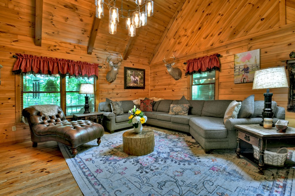 270 Stone Lane Blue Ridge, GA 30513 - Photo 63 of 70 a living room with furniture a fireplace and a table