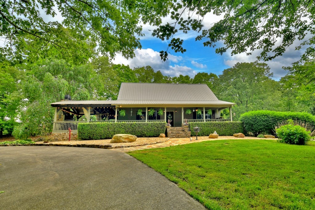 270 Stone Lane Blue Ridge, GA 30513 - Photo 70 of 70 a front view of a house with garden