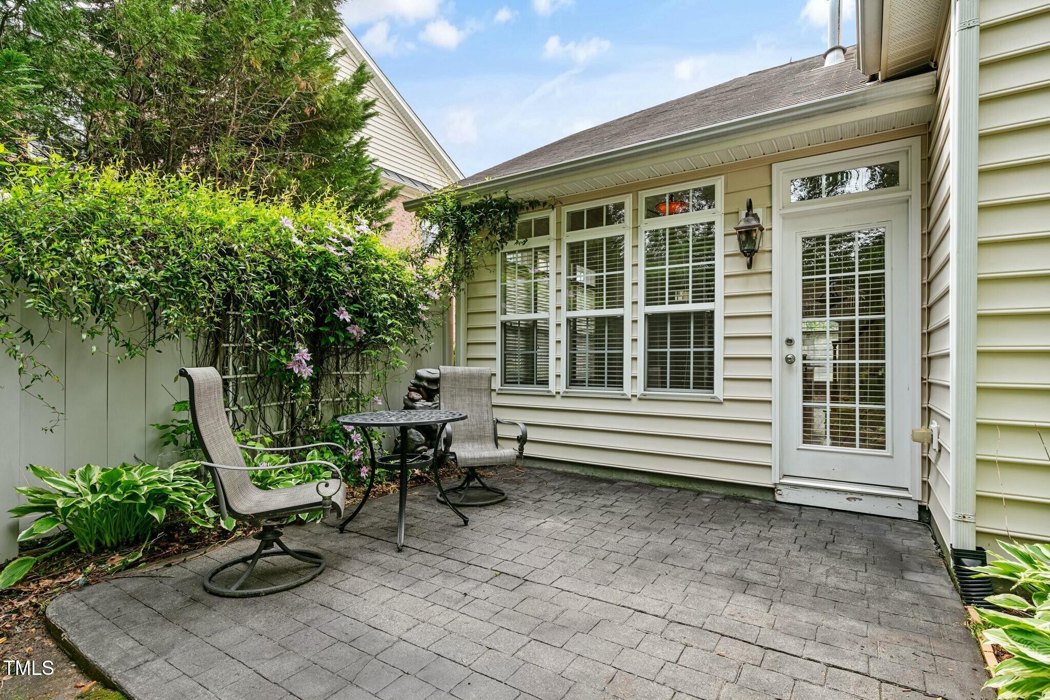 13338 Ashford Park Drive Raleigh, NC 27613 - Photo 35 of 44 a balcony with couple of chairs and a table in a patio