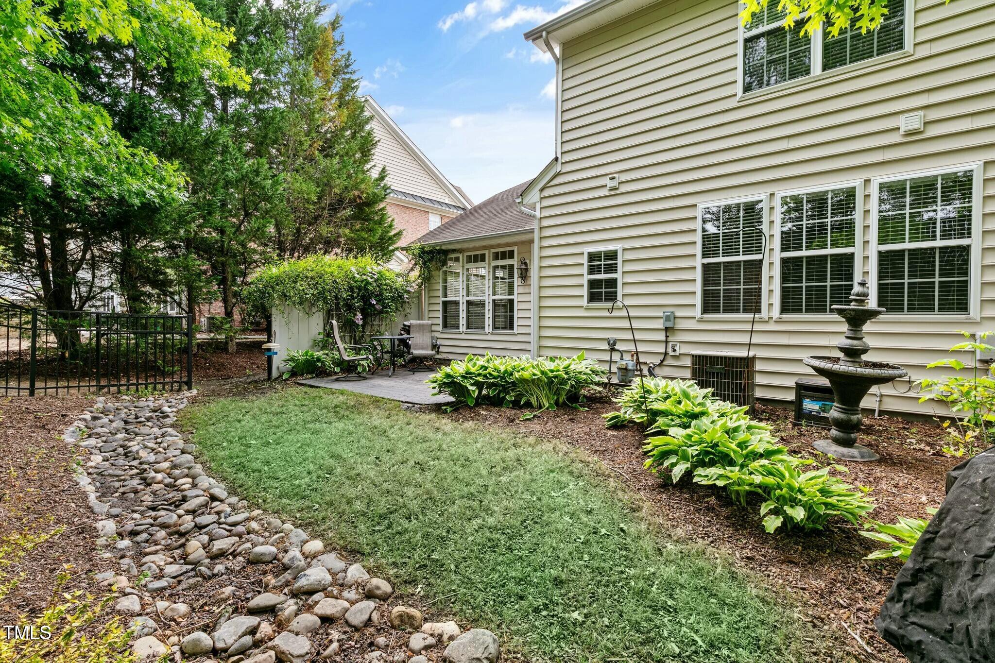 13338 Ashford Park Drive Raleigh, NC 27613 - Photo 37 of 44 a house view with a garden space
