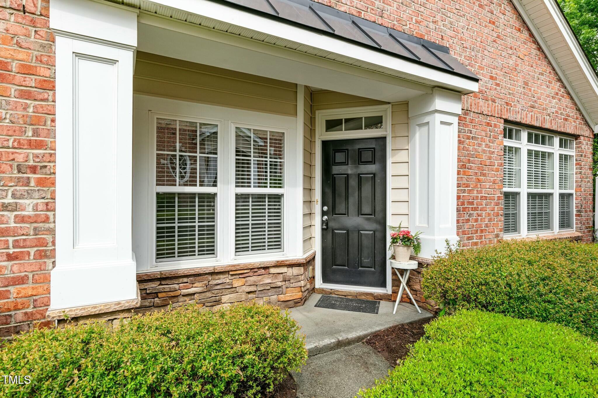 13338 Ashford Park Drive Raleigh, NC 27613 - Photo 39 of 44 a front view of a house with a yard