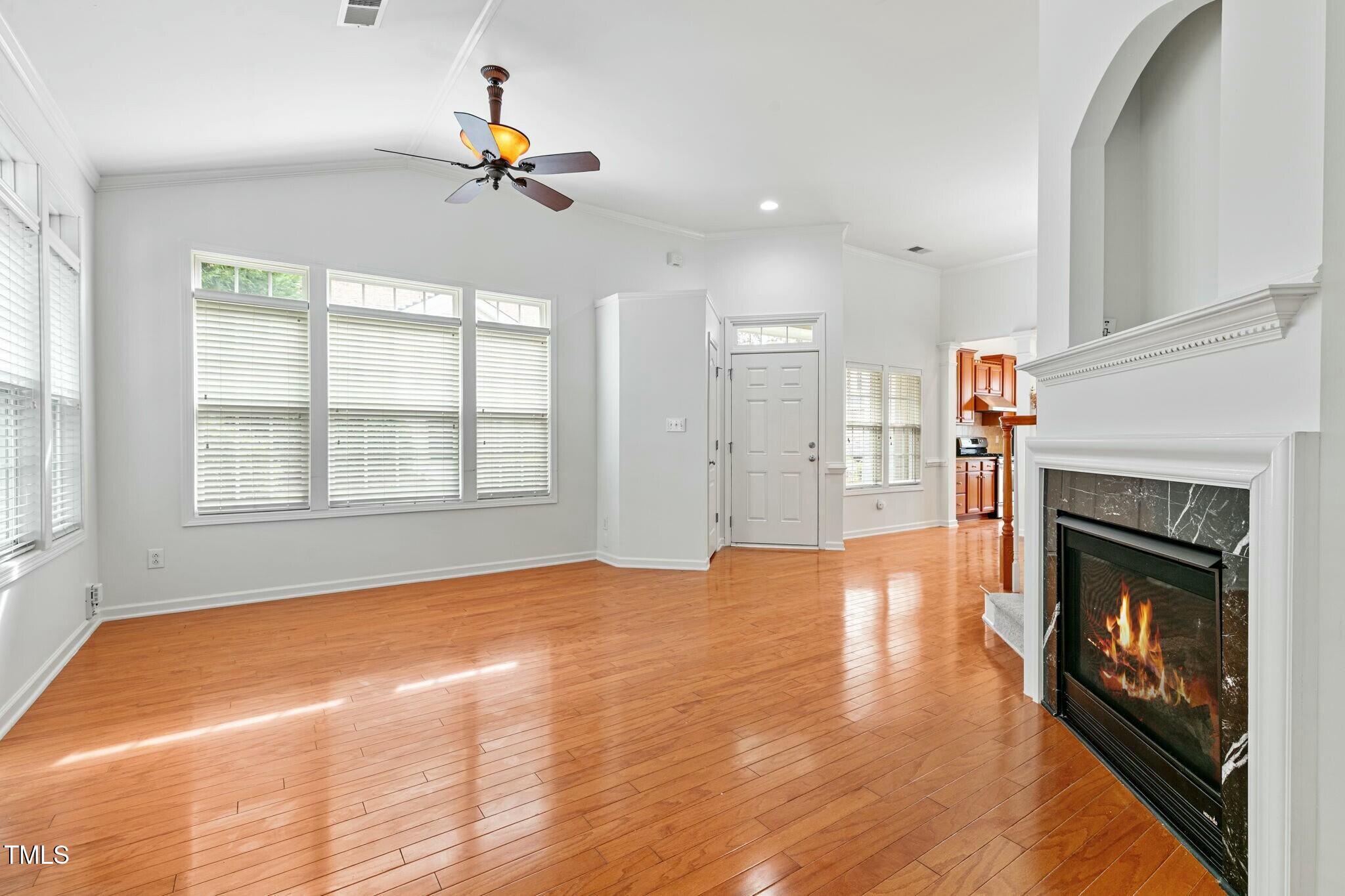 13338 Ashford Park Drive Raleigh, NC 27613 - Photo 6 of 44 a view of a livingroom with a fireplace and window