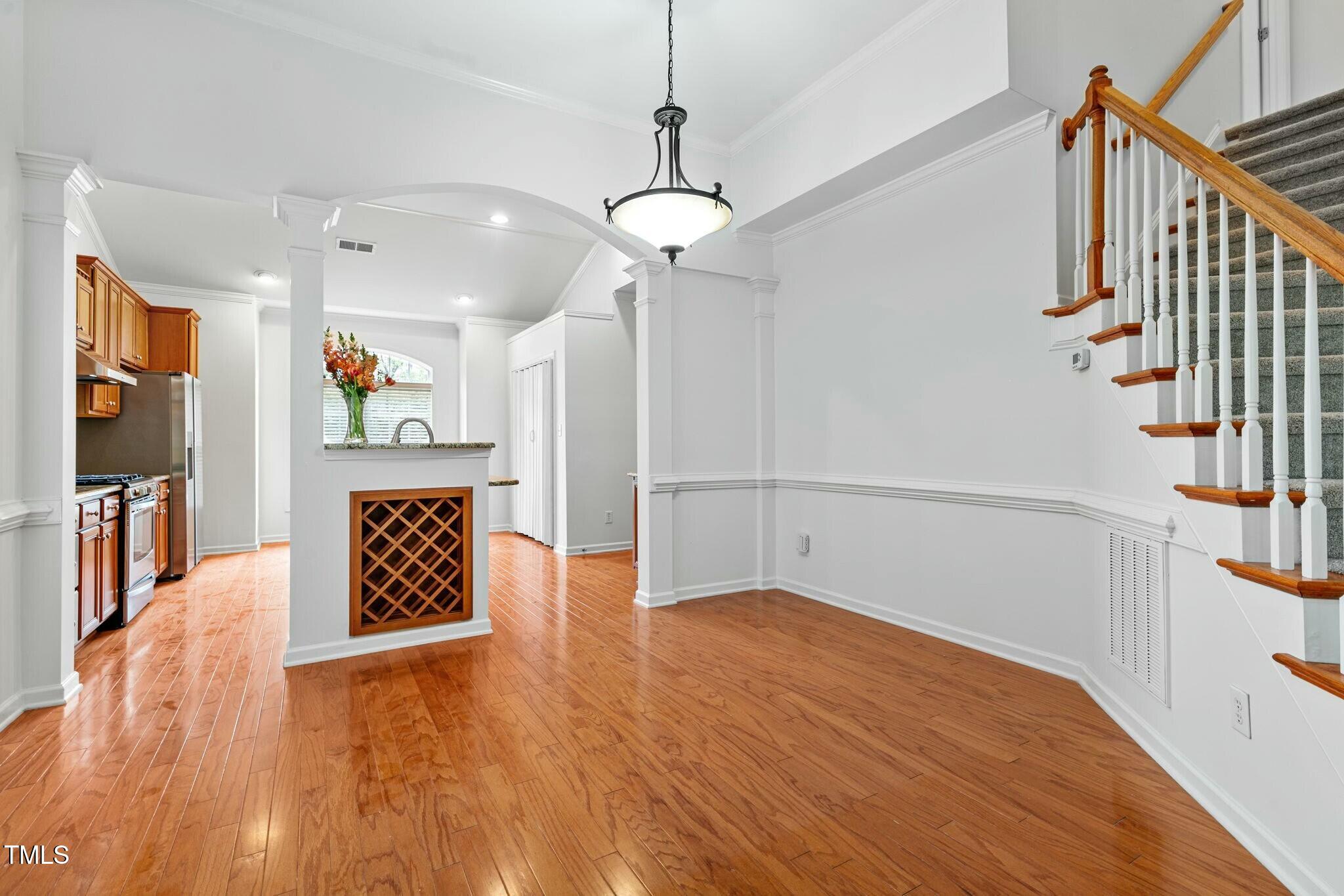 13338 Ashford Park Drive Raleigh, NC 27613 - Photo 9 of 44 a view of an entryway with wooden floor