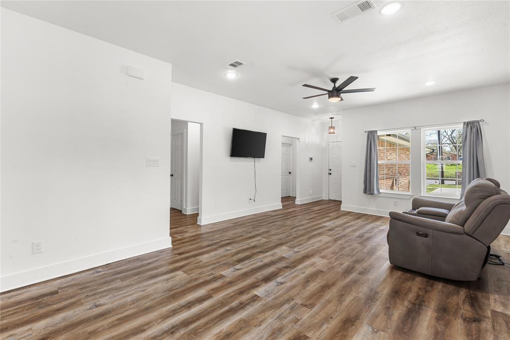 101 Ross Street Sulphur Springs, TX 75482 - Photo 6 of 30 Living area featuring dark wood finished floors, recessed lighting, and a ceiling fan