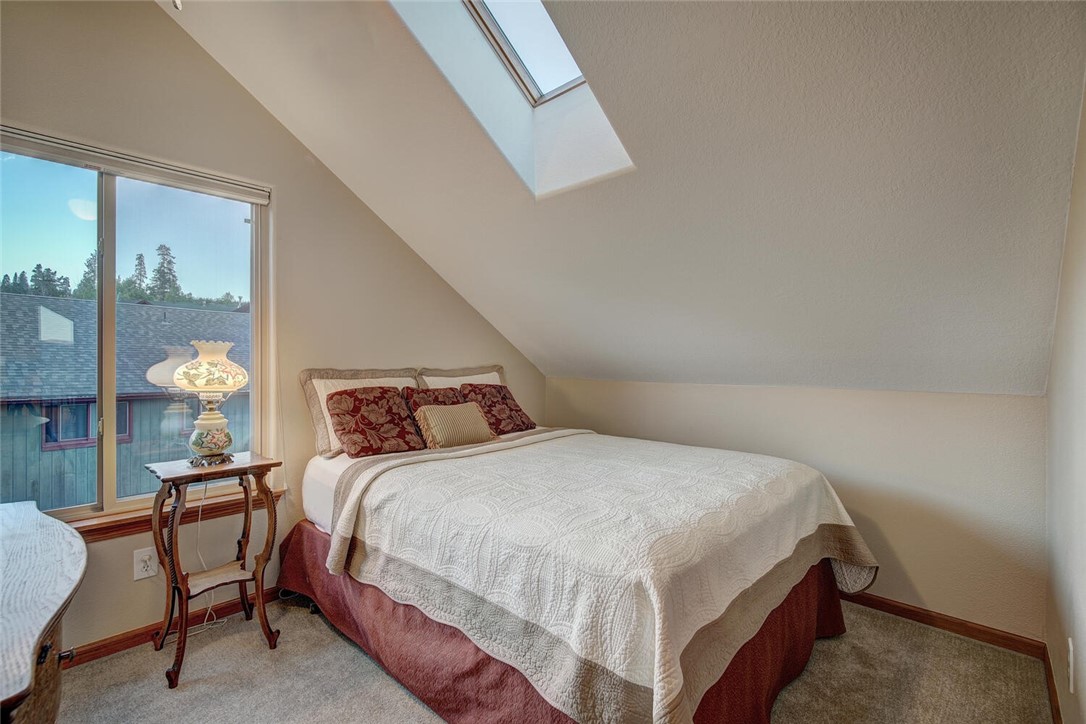 592 Ryan Gulch Road Silverthorne, CO 80498 - Photo 23 of 35 The third bedroom with lots of natural light.