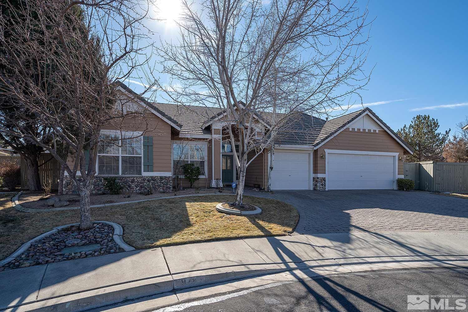 9785 Rolling Rock Court Reno, NV 89521 - Photo 1 of 35 a front view of a house with garden