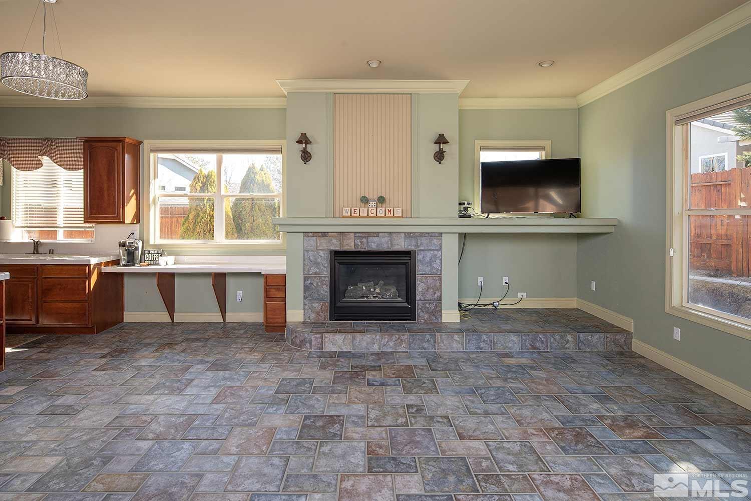 9785 Rolling Rock Court Reno, NV 89521 - Photo 15 of 35 a living room with furniture and a fireplace