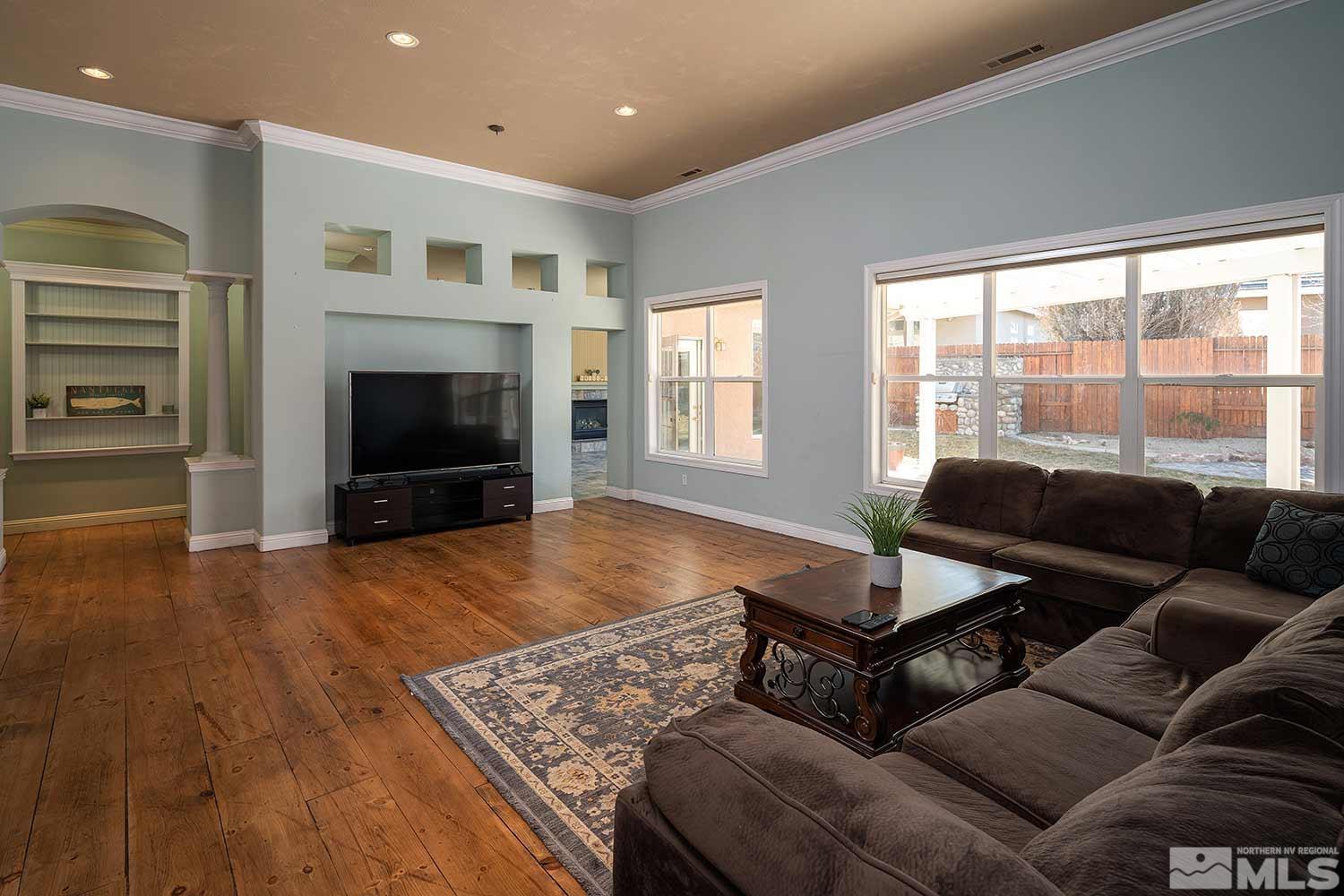 9785 Rolling Rock Court Reno, NV 89521 - Photo 3 of 35 a living room with furniture and a fireplace
