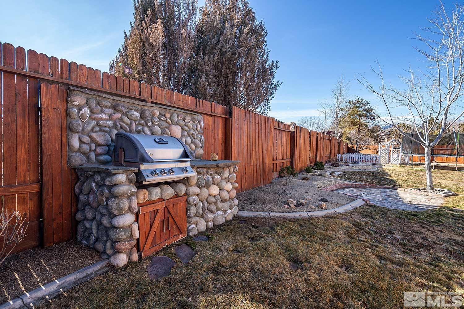 9785 Rolling Rock Court Reno, NV 89521 - Photo 31 of 35 a view of a yard with wooden fence