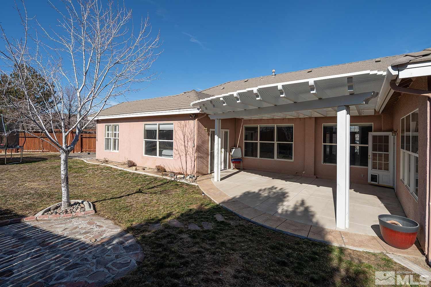 9785 Rolling Rock Court Reno, NV 89521 - Photo 32 of 35 a front view of a house with garden