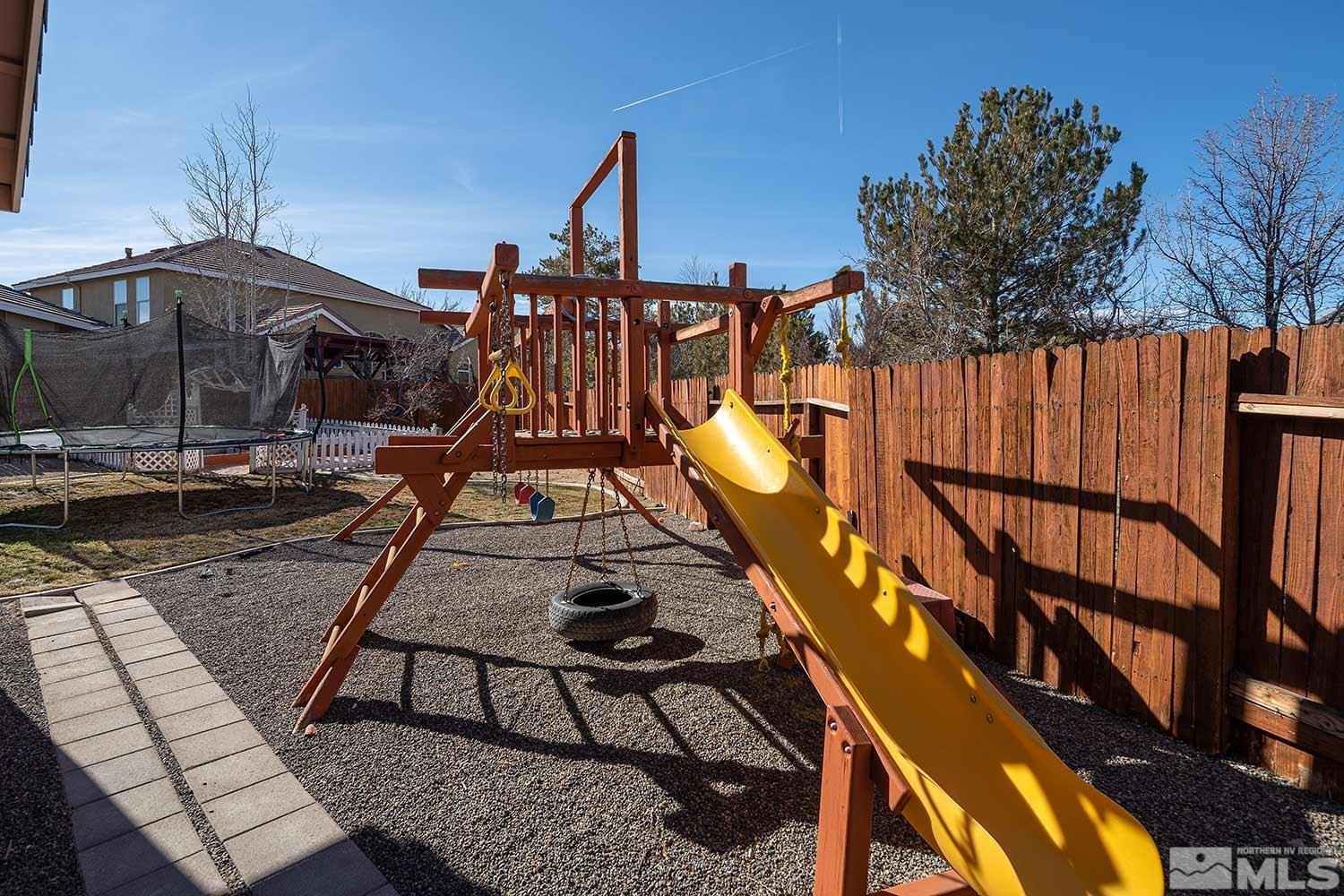 9785 Rolling Rock Court Reno, NV 89521 - Photo 35 of 35 a view of a swimming pool with a deck