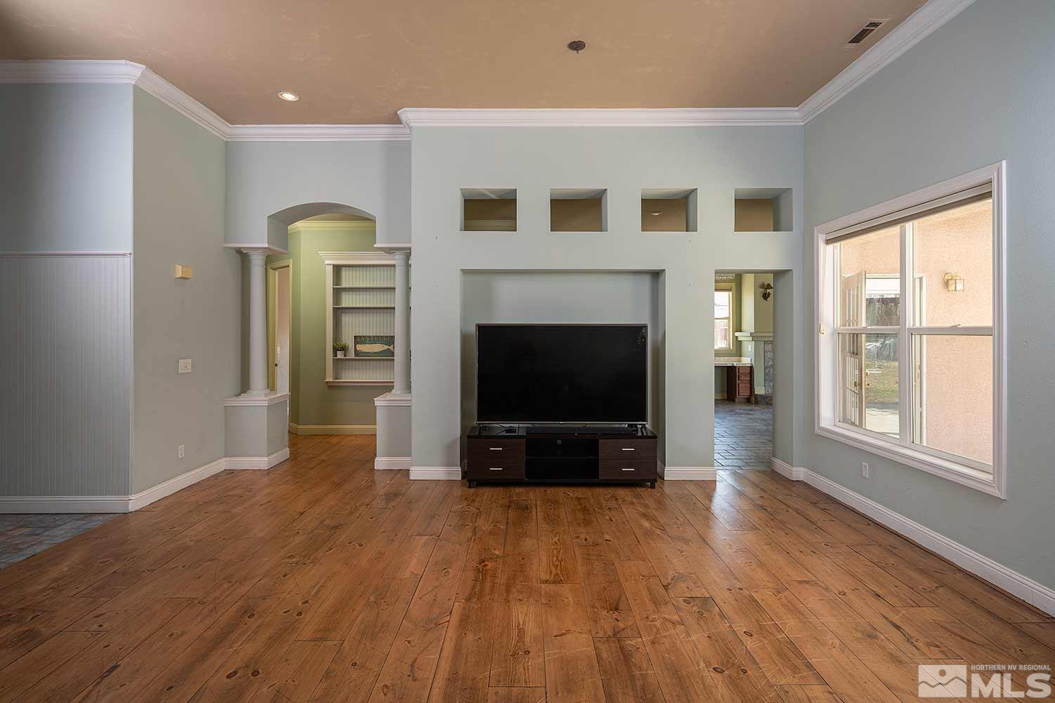 9785 Rolling Rock Court Reno, NV 89521 - Photo 4 of 35 a living room with furniture and a fireplace