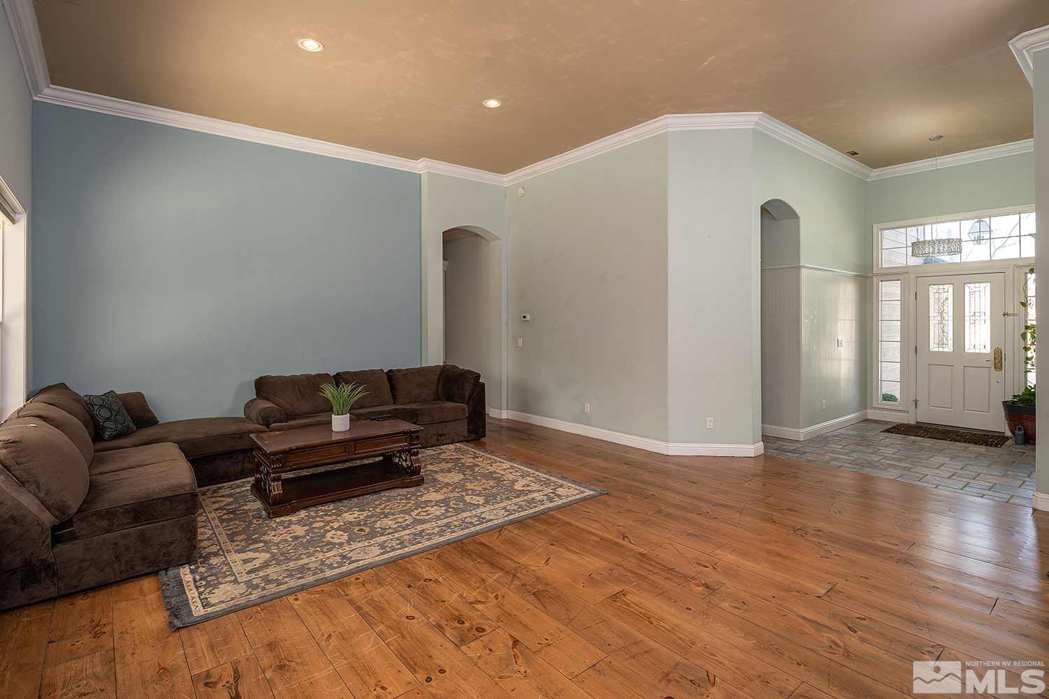 9785 Rolling Rock Court Reno, NV 89521 - Photo 5 of 35 a living room with furniture and a rug