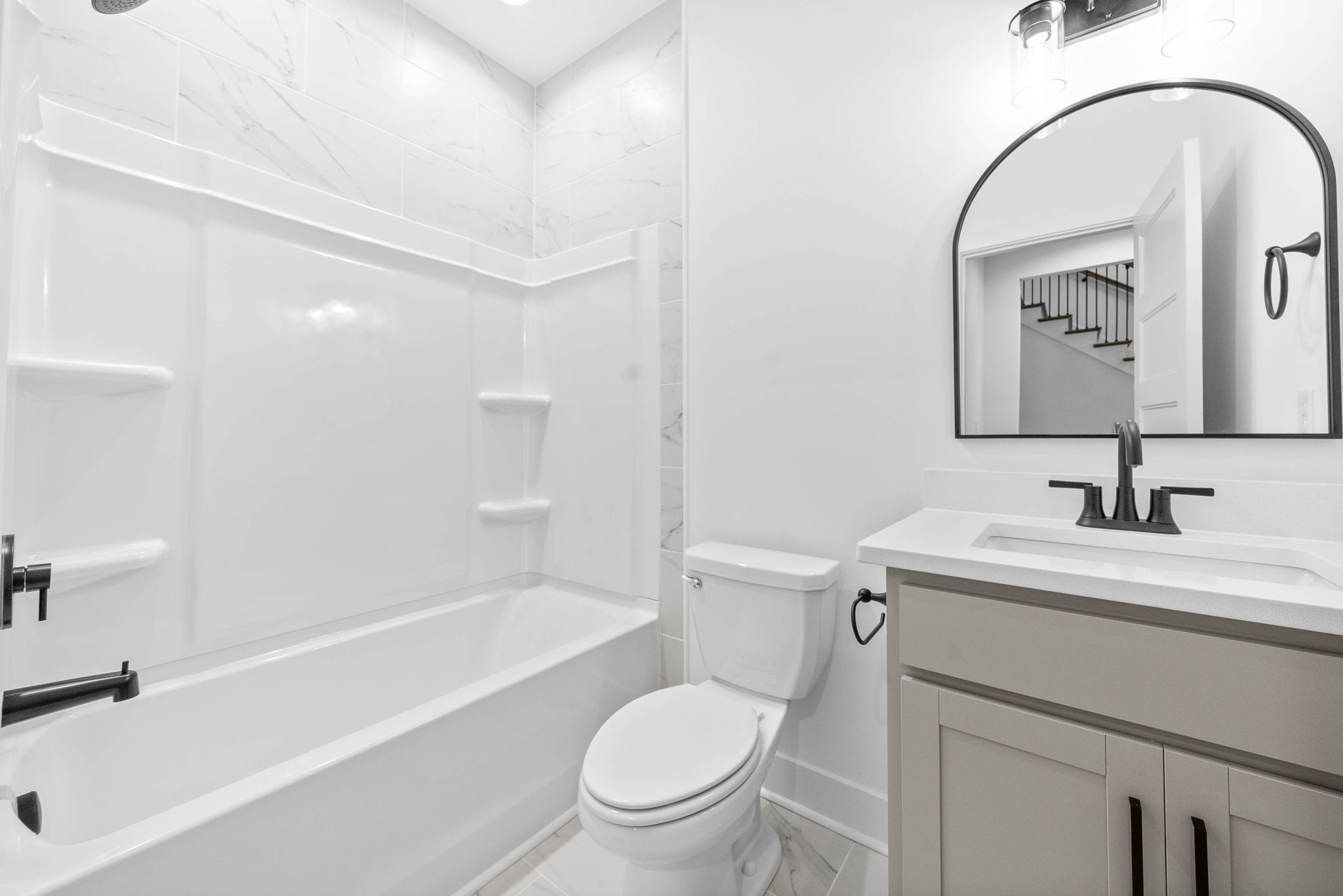 1360 Reda Drive Clarksville, TN 37042 - Photo 27 of 41 a bathroom with a toilet sink vanity tub and mirror