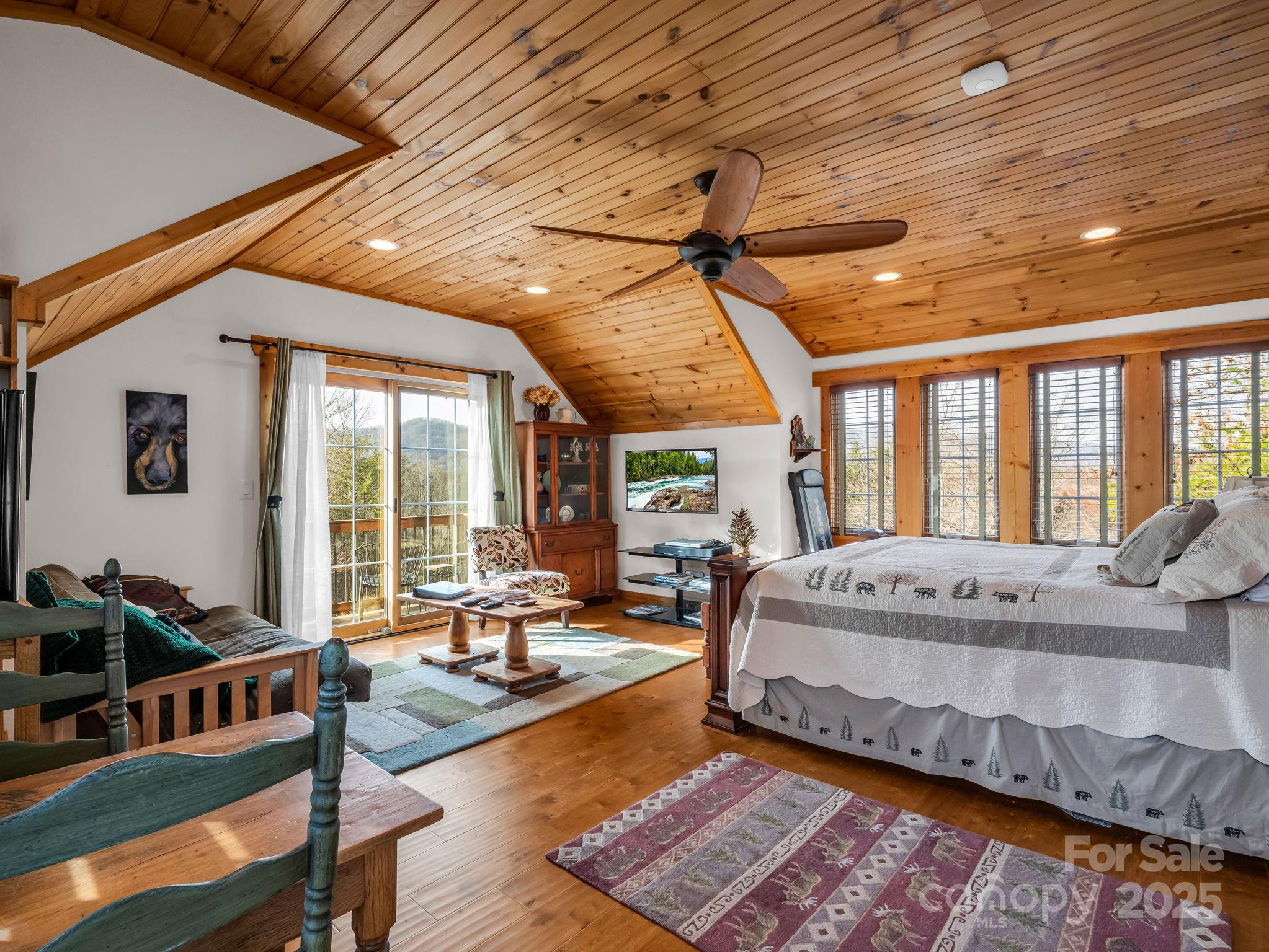 301 Peaks Drive Lake Lure, NC 28746 - Photo 22 of 48 a bed sitting in a bedroom next to a large window