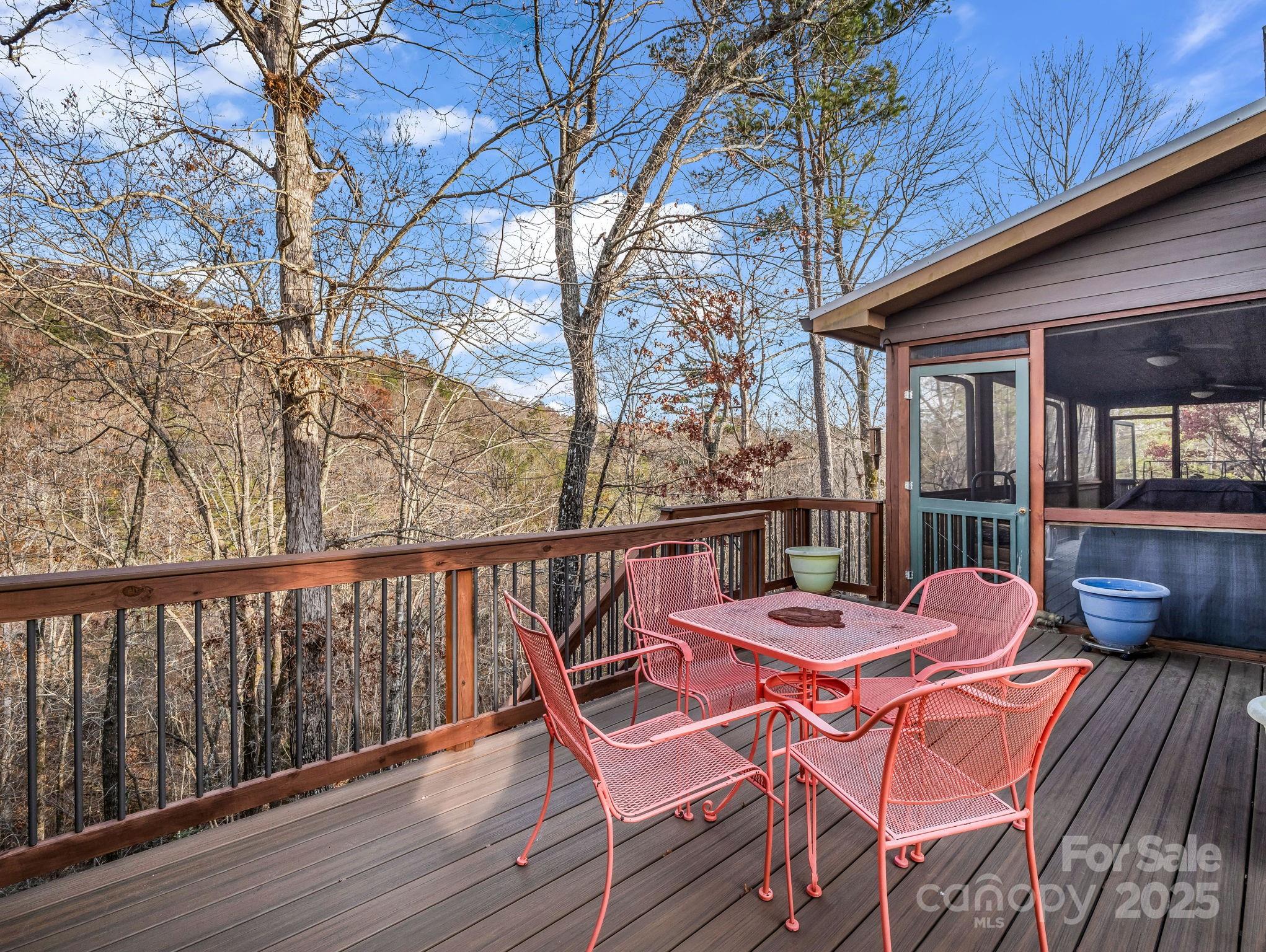 301 Peaks Drive Lake Lure, NC 28746 - Photo 36 of 48 a balcony with wooden floor table and chairs