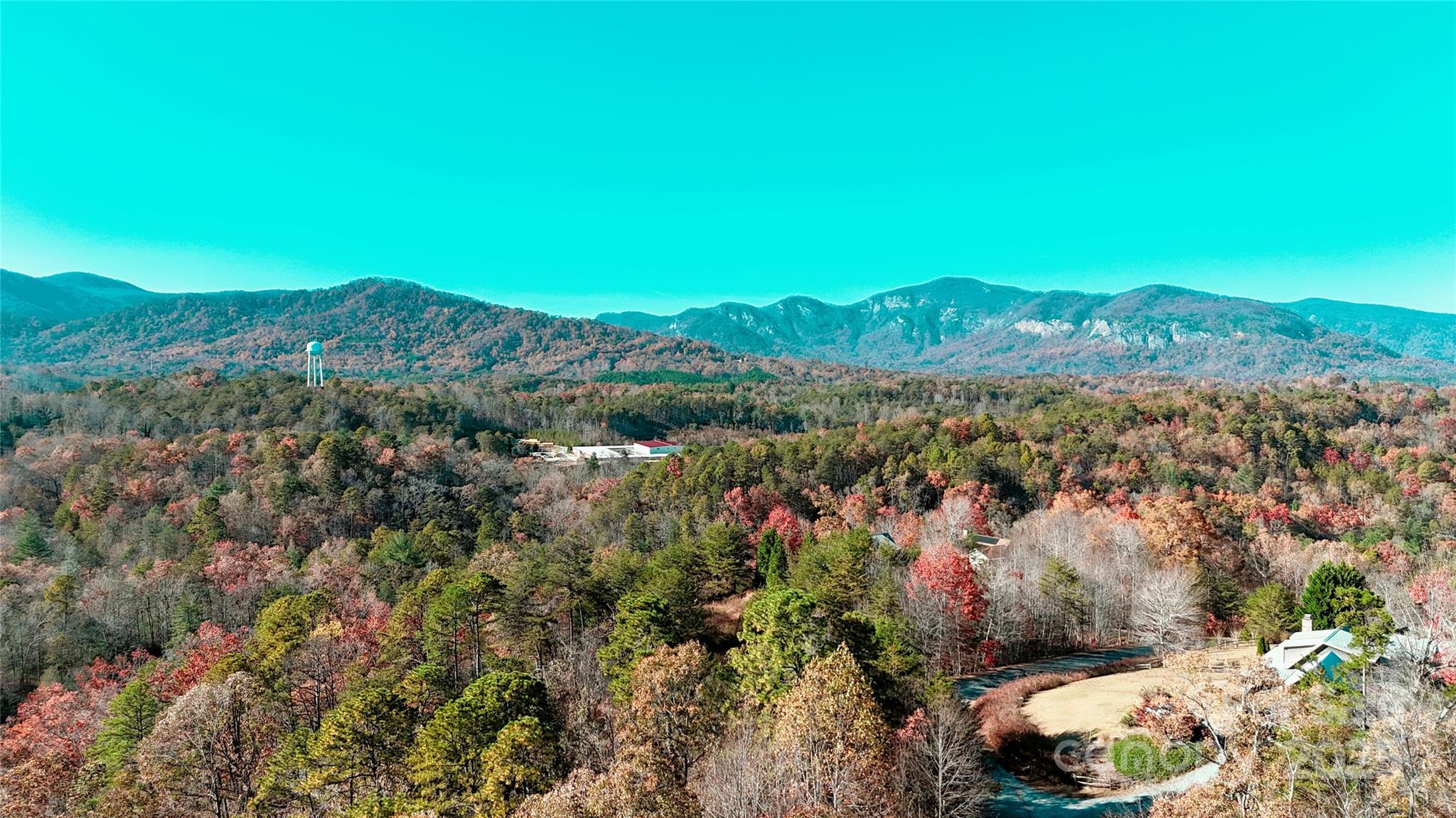 301 Peaks Drive Lake Lure, NC 28746 - Photo 45 of 48 a view of a green field with mountains in the background