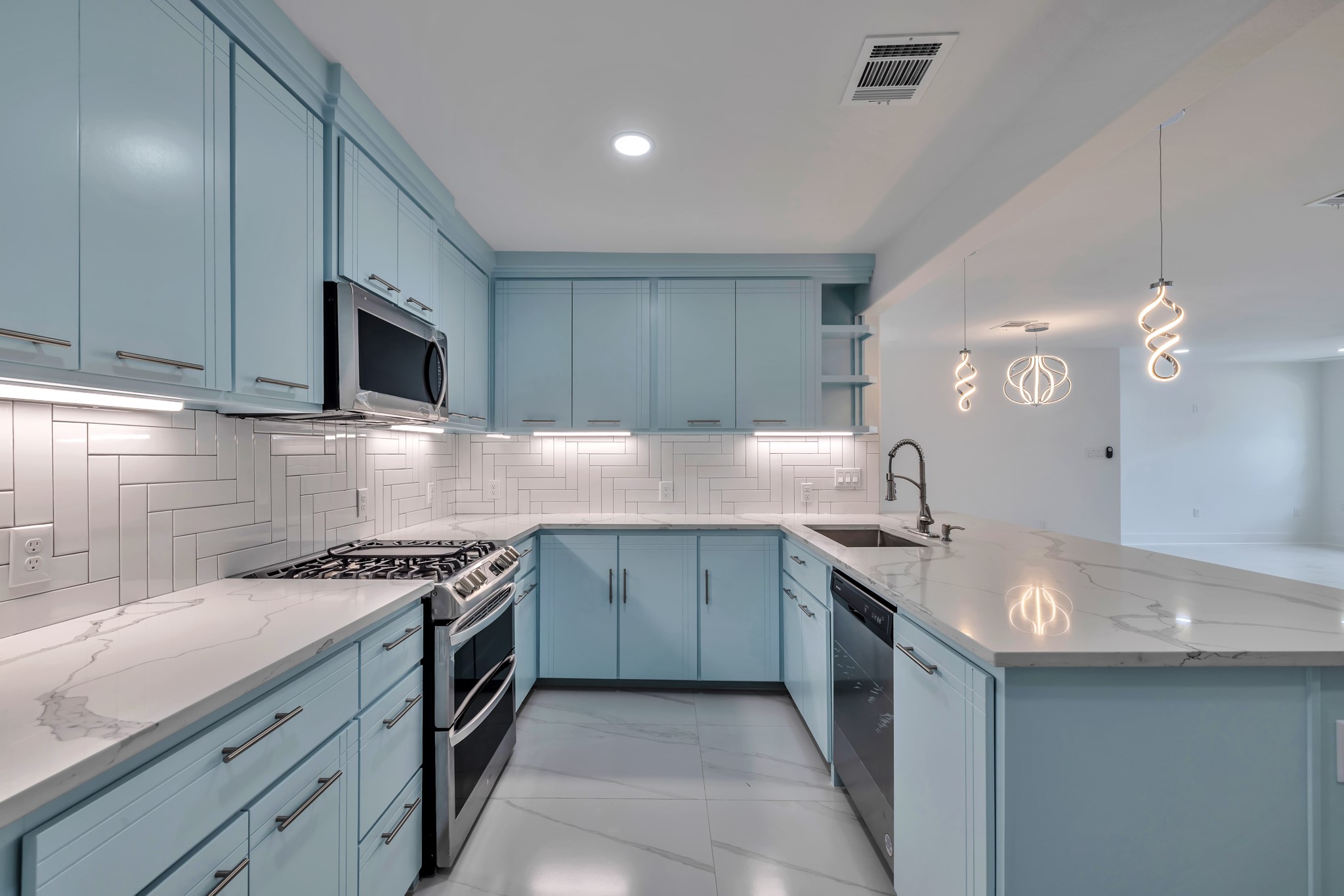 8709 Tarbell Road Houston, TX 77034 - Photo 10 of 25 a kitchen with granite countertop a sink a stove and cabinets