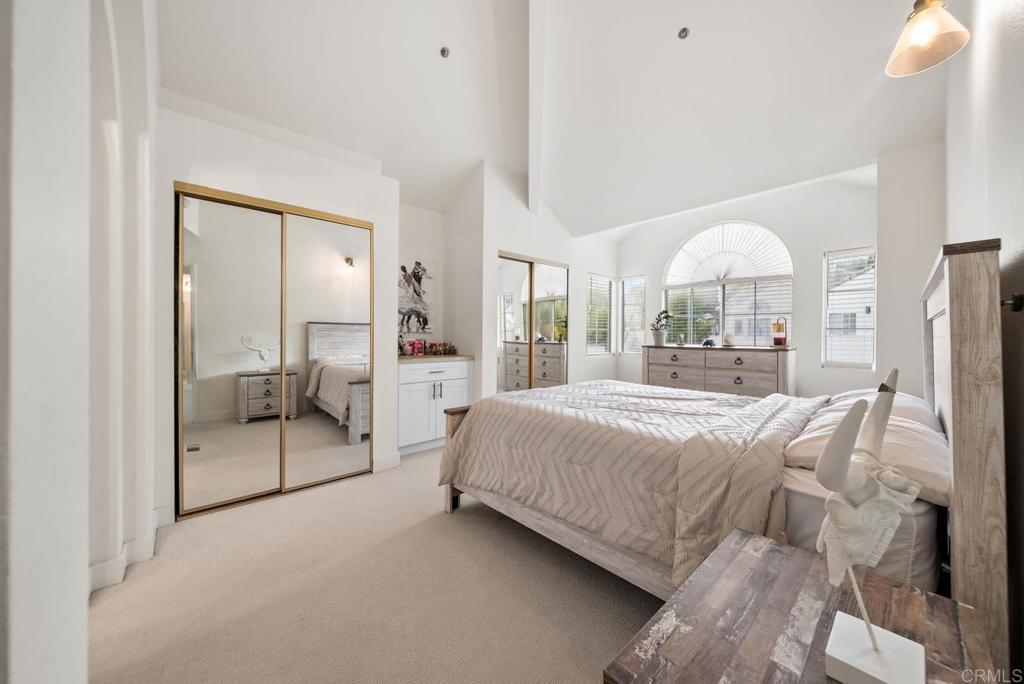 3863 Settineri Lane Spring Valley, CA 91977 - Photo 17 of 39 a bedroom with a large bed and a large window