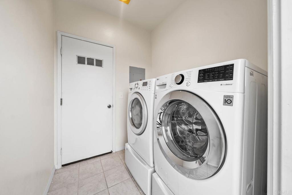 3863 Settineri Lane Spring Valley, CA 91977 - Photo 24 of 39 a utility room with dryer and washer