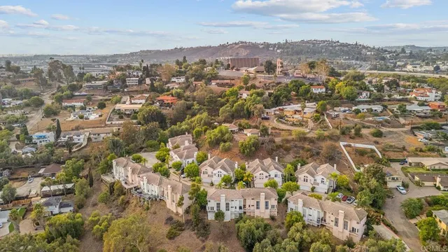 an aerial view of residential building with green space