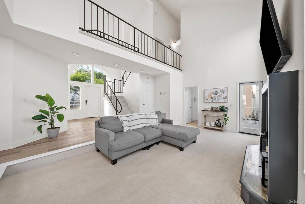 3863 Settineri Lane Spring Valley, CA 91977 - Photo 5 of 39 a living room with furniture fireplace and a flat screen tv