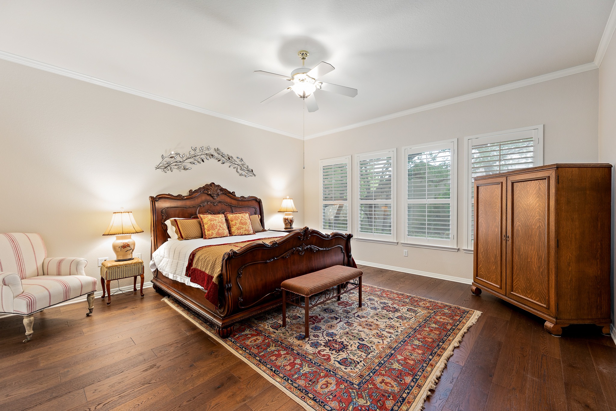 106 Wild Turkey Lane Georgetown, TX 78633 - Photo 22 of 39 a bedroom with a large bed and a chandelier