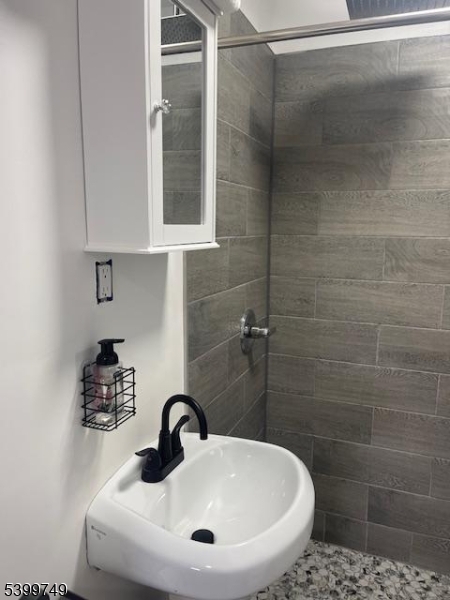 2420 East Edgar Road, Unit 2 Linden, NJ 07036 - Photo 5 of 8 a bathroom with a sink a toilet and shower