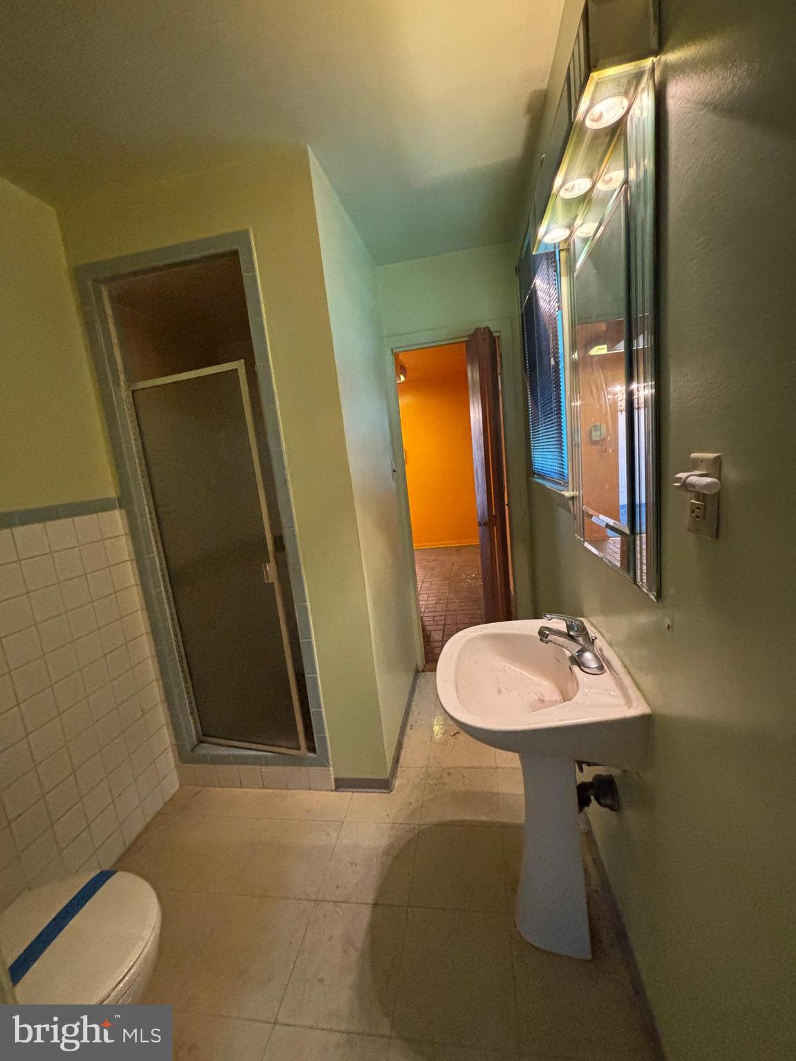 423 Park Boulevard Moorestown, NJ 08057 - Photo 8 of 24 a bathroom with a sink and a mirror